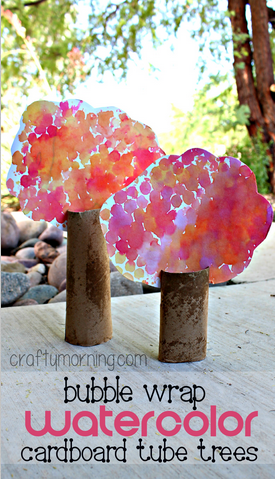 Fall Crafts For Kids- Bubble wrap fall tree with red, prink and orange leaves and a toilet paper tube base.